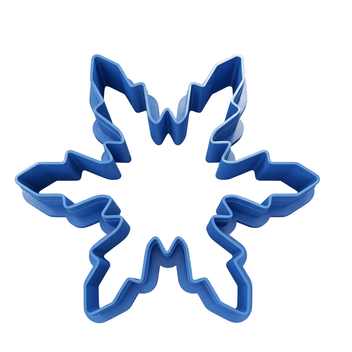 A blue snowflake-shaped cookie cutter shown from an overhead angle on a transparent checkerboard background.